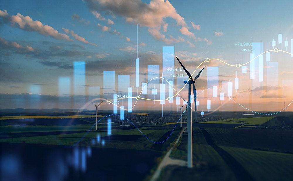 Odkup energii z OZE. Odkup energii z OZE. Słupki cen energii zna RDN nałożone na krajobraz z wiatrakami.